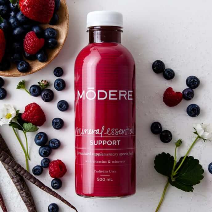 Alkaline World Modere Mineral Essentials 500ml bottle of essential minerals in clear liquid, with label visible on the bottle.