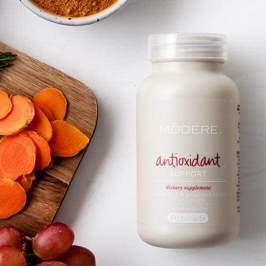 Modere Antioxidant supplement bottle with 60 capsules, featuring a clean label design and white bottle with a blue cap.