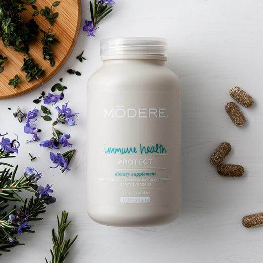 Modere Immune Health supplement bottles, 180 count, featuring the product label and packaging for immune support.
