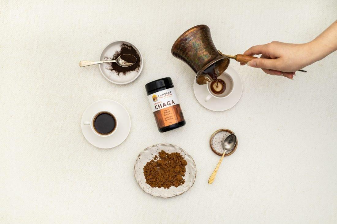 Sunbear Organic Chaga Mushroom extract bottle with label, highlighting Sunbear Premium Organic Chaga Extract 11:1 ratio for health benefits.