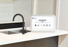 Black Aquarius M25 hydration system with 3-way tap, featuring a durable design for efficient water dispensing and hydration.