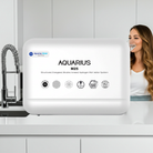 Aquarius Water M25 alkaline ionised structured water system bench top filter showing the device with control panel and water outlet.