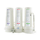 Aquarius Water triple bench top filter for fluoride and alkaline water, with sleek design and filtration components visible.