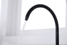 Black Aquarius Water 3-way mixer tap with dual spout and pull-out spray, designed for kitchen or bathroom sinks.
