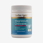 Herbs of Gold Magnesium Chewable tablets in a bottle, showing the label and 60 chewable magnesium supplement tablets inside.