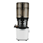 Kuvings AUTO10 PLUS white cold press juicer on kitchen countertop showing its compact design and feeding chute.