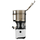 Kuvings AUTO10 PLUS white cold press juicer on kitchen countertop, showcasing its compact design and sleek white finish.