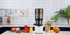 Kuvings AUTO10 PLUS Cold Press Juicer in white showing the compact juicer with its sleek design and feeding chute.