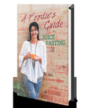 Kuvings brand foodies guide to juice fasting, featuring a colorful juice and healthy lifestyle tips on the cover.