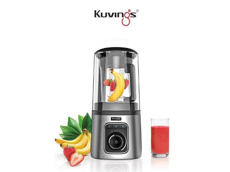 Pre-owned Kuvings high-speed quiet vacuum blender on a kitchen countertop, showcasing its sleek design and control panel.