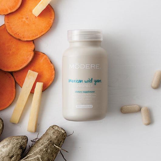 Modere Mexican Wild Yam supplement bottle with 60 capsules, featuring the product label and branding.