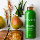 Modere Aloe Vera 500ml bottle with clear label and green cap, showcasing fresh aloe vera gel inside.