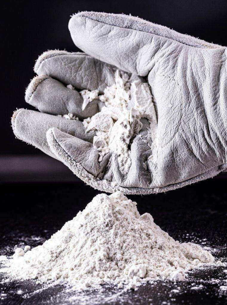 Natural Superfoods ZeoOne Zeolite Powder 500g in a resealable bag, showcasing the fine, gray mineral powder from Zeolite Australia.